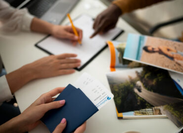 close-up-hand-signing-document-with-pencil